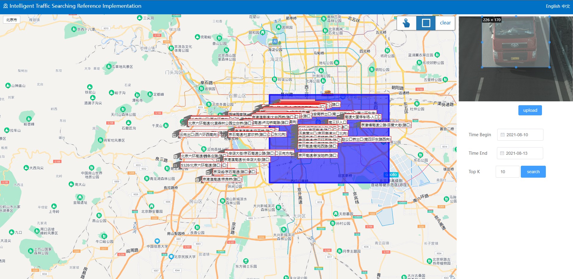 A browser window showing a large map of a city. Many vehicles are identified on the map. A rectangular area is highlighted in blue.