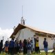 Technical team installing WiMax antenna at Lila school with kids