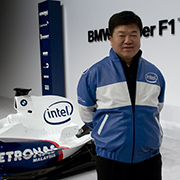 LOGO TO GO-FAST: Intel Marketing Chief Eric Kim is all smiles as the newest BMW Sauber F1 car is unleashed with Intel’s new logo in Valencia Spain. The official corporate sponsorship is part of a broader technology and co-marketing agreement between the renowned car maker and the technology innovator known for its computer chips.